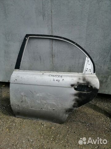 Дверь задняя левая Kia Spectra, б/у серебро